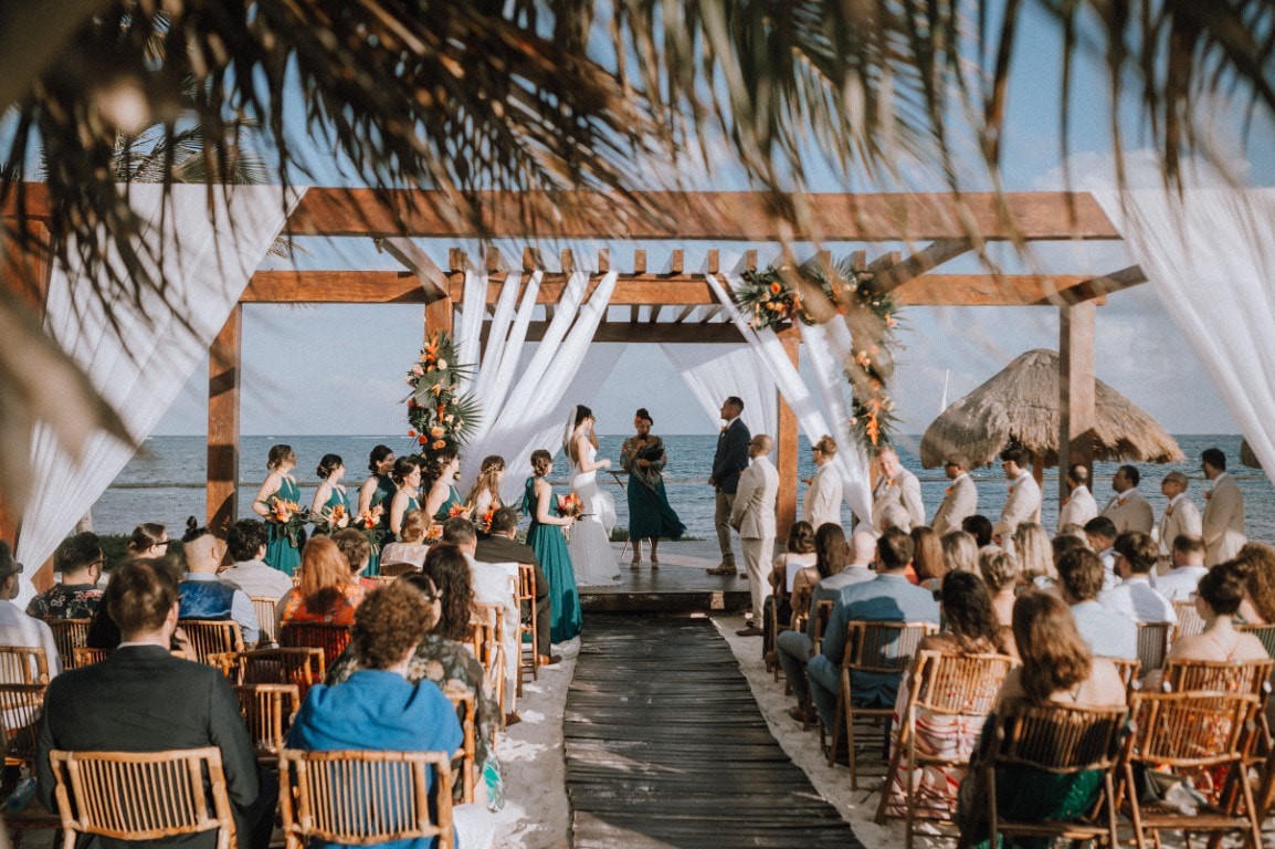 Intimate destination wedding ceremony on the beach