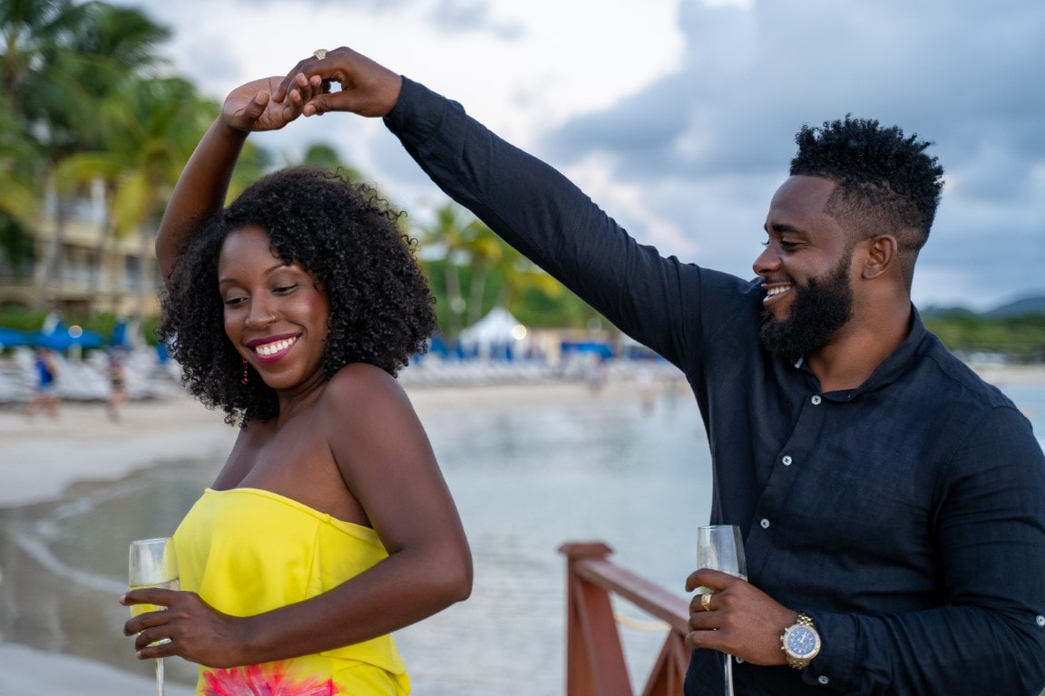 Couple celebrating together by the water in St. Lucia