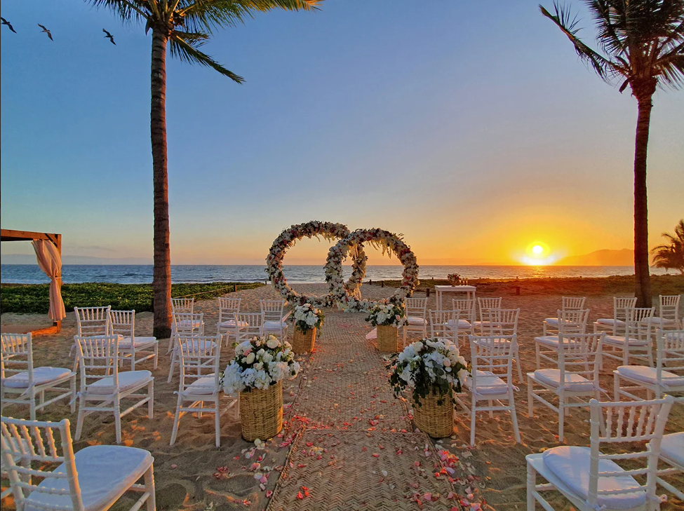 Beachfront wedding ceremony at Marival Resorts