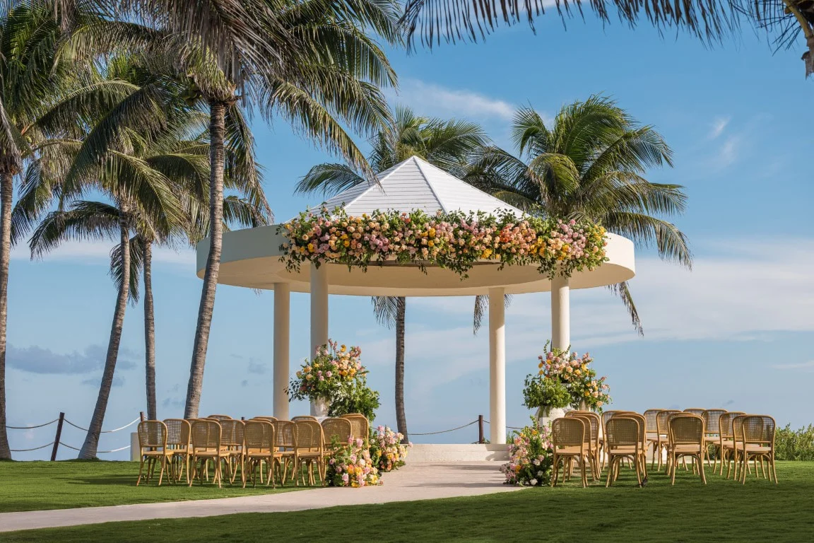 Destination wedding ceremony setup with ocean view